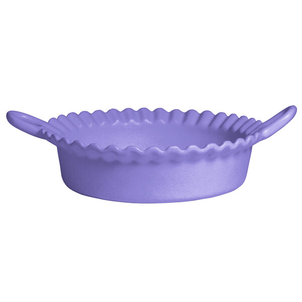 A lavender resin-coated aluminum deep Mexican cazuela with a wavy edge and handles.