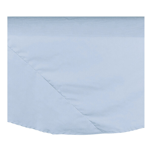 A light blue cloth table cover with a folded edge.