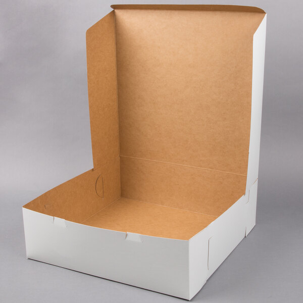 A white cake box with an open brown lid.