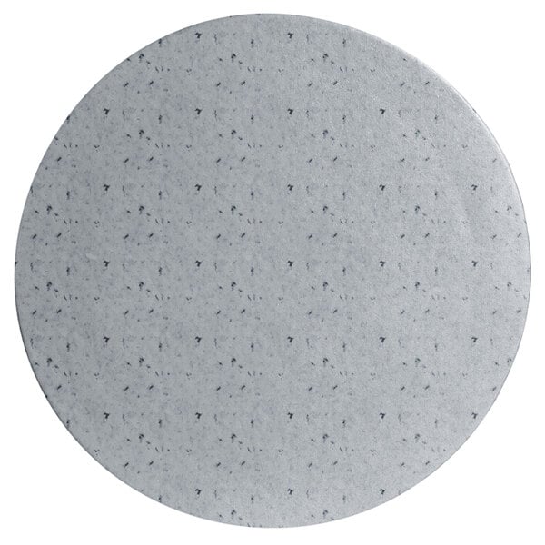 A white round disc with black specks.