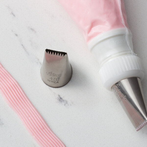 A close-up of a pink plastic pastry nozzle.