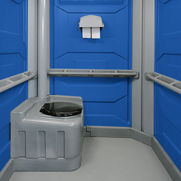A PolyJohn wheelchair accessible portable restroom with a blue interior.