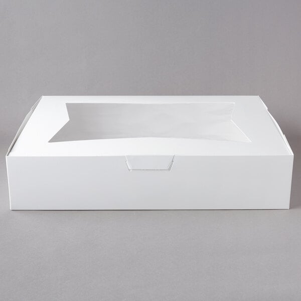A white rectangular bakery box with a clear window on top.