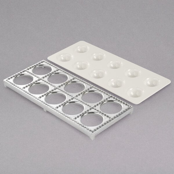 A white metal tray with 10 holes.