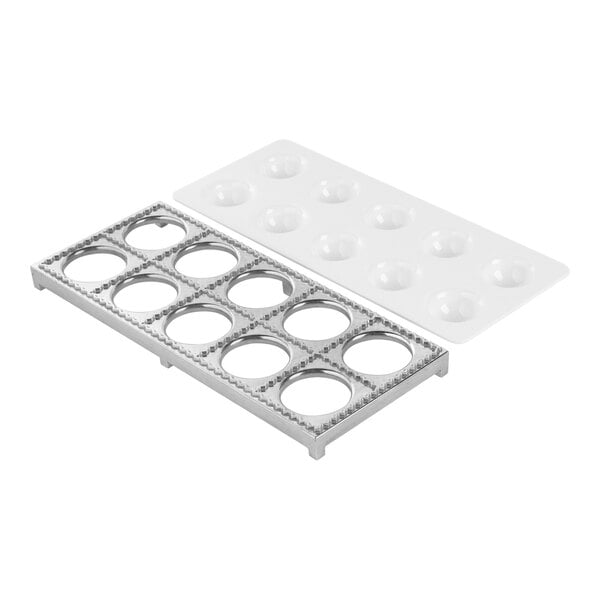 A metal tray with circular cutouts and a white plastic mold, both designed for making multiple round ravioli at once.