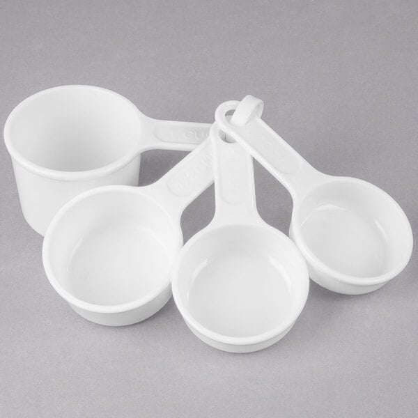 A set of four plastic measuring cups.