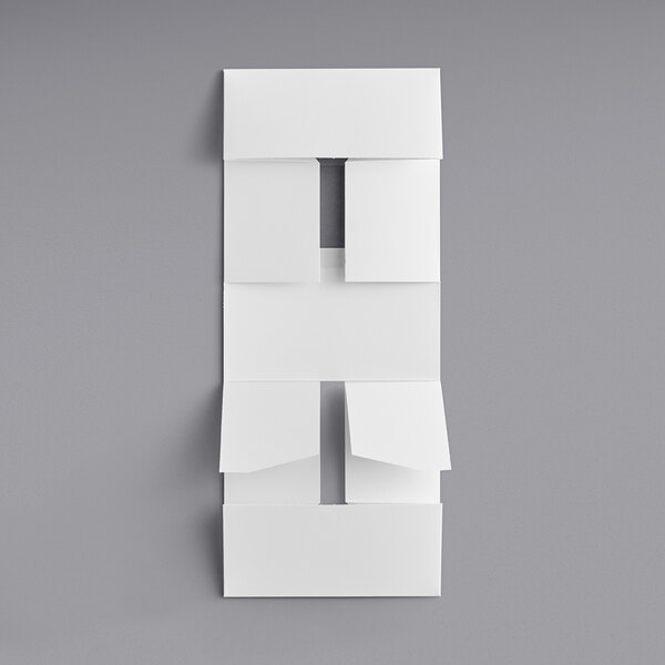 A white folded paper with a few squares.