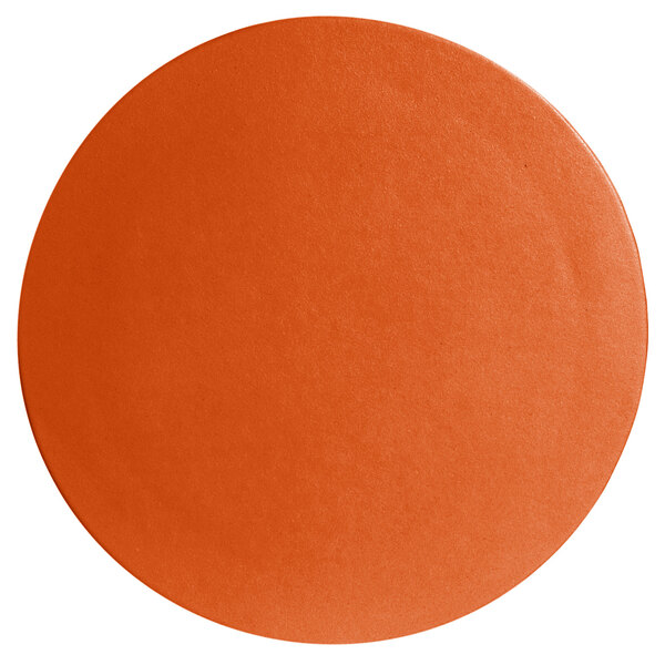 A close up of a G.E.T. Enterprises Bugambilia tangerine resin-coated aluminum round disc with a textured finish.