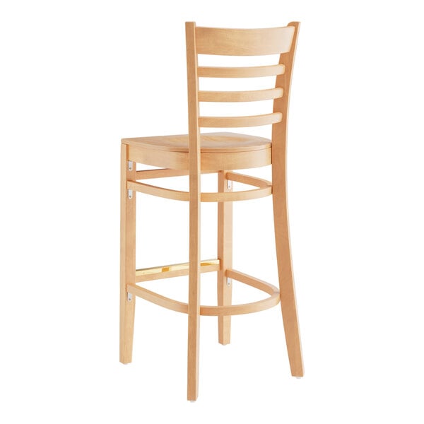 A Lancaster Table & Seating natural wood bar stool with a ladder back and natural wood seat.