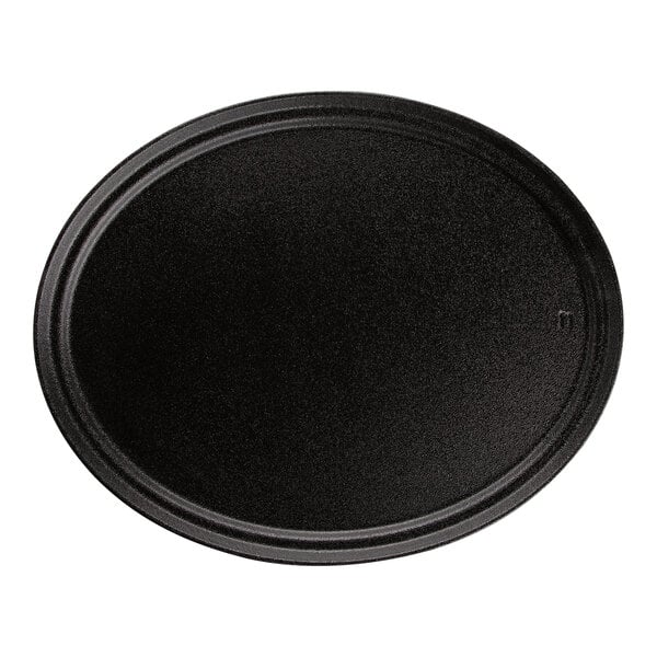 A black oval Carlisle Griptite non-skid serving tray.