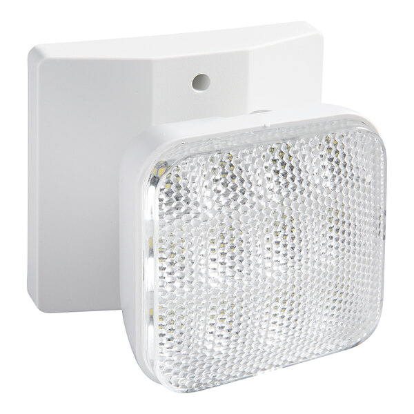 A white Lavex LED emergency light fixture on a white wall.
