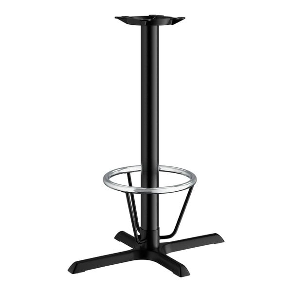 A Lancaster Table & Seating black cast iron bar height table base with a foot ring.