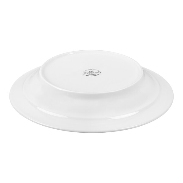 A white porcelain bowl shown upside down with a small circular logo or label at the center of its base.