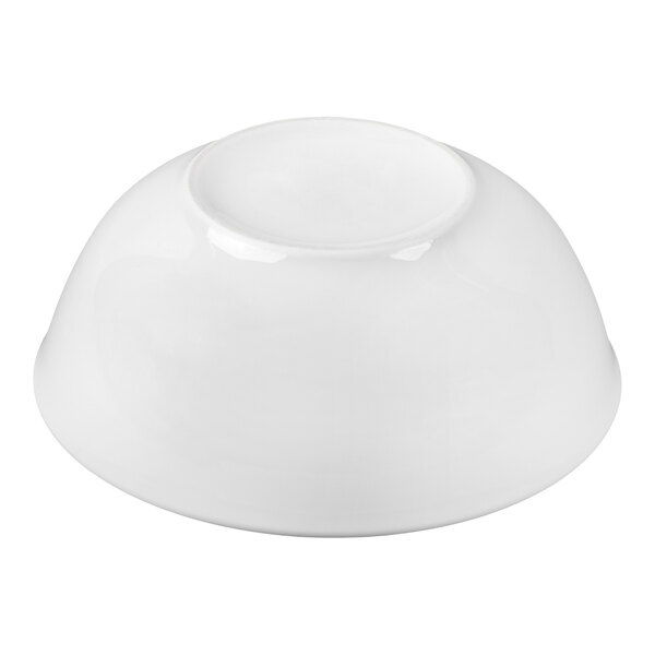 A white porcelain bowl shown upside down on a plain background.