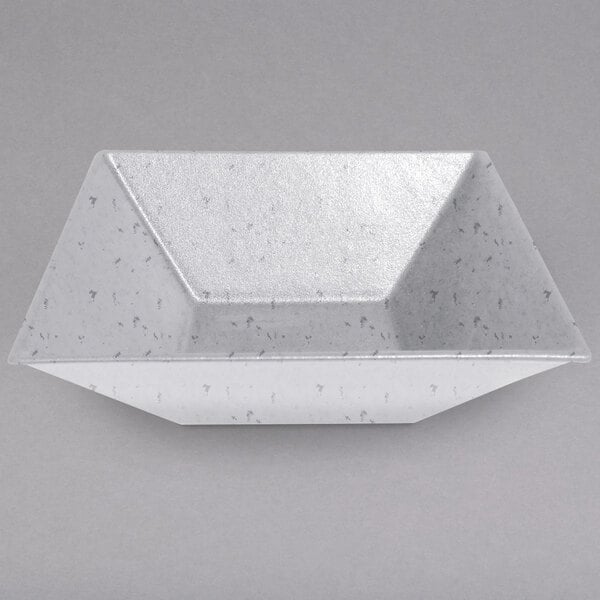 a white container with a triangular shape