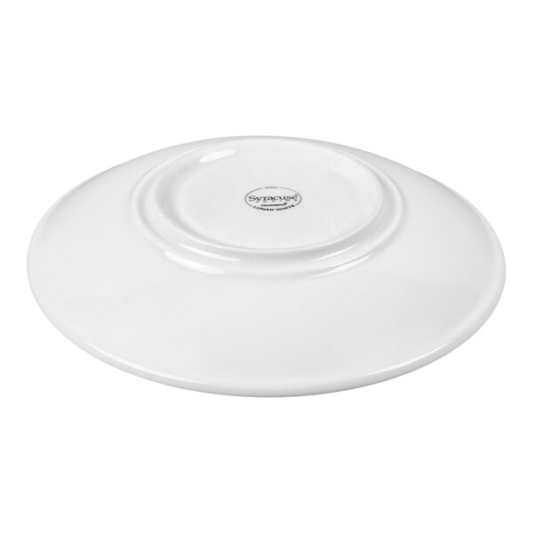 A white porcelain saucer shown upside down with a small circular base and a smooth, glossy finish.