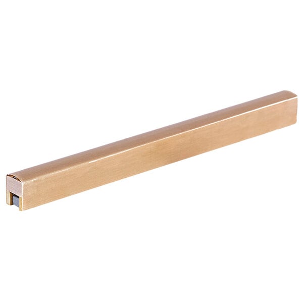 A long rectangular brass colored metal seal bar with a black tip.