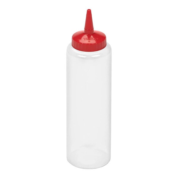 A clear plastic squeeze bottle with a red pointed cap.