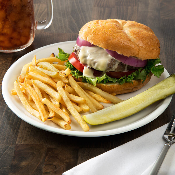 A Libbey Rigel Constellation porcelain plate with a burger and fries.