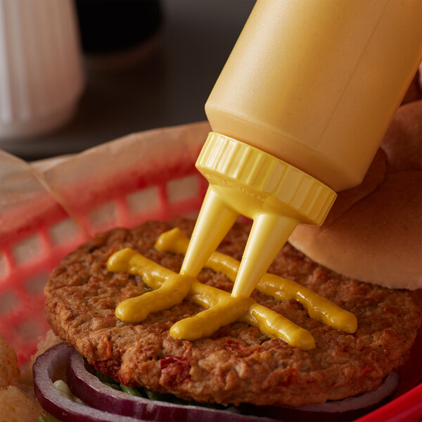 a mustard bottle on a bun