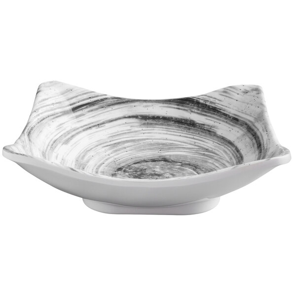 a white bowl with black and white design