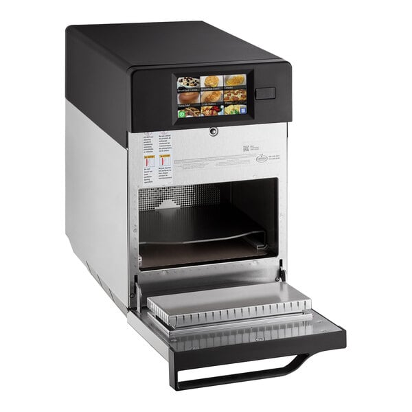 An ACP XpressChef 3i high-speed countertop oven on a school kitchen counter.