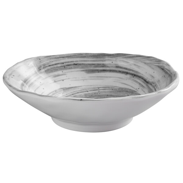 a white bowl with black stripes