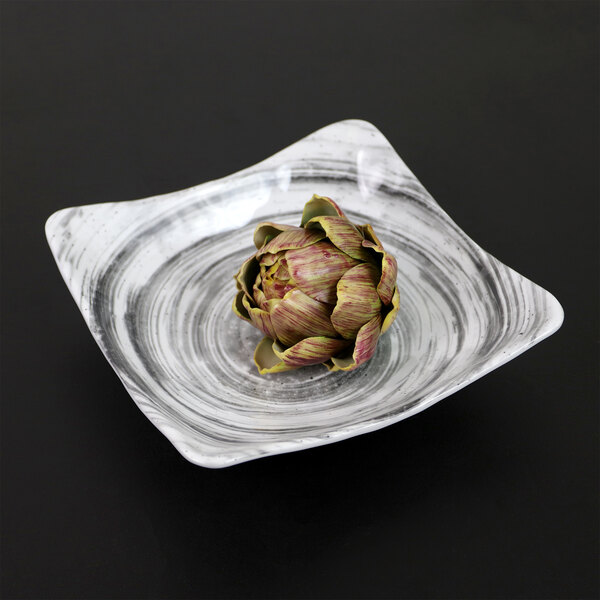 An artichoke on a square black Elite Global Solutions melamine bowl.