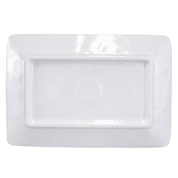 A white rectangular plate with a navy blue Van Gogh design on it.