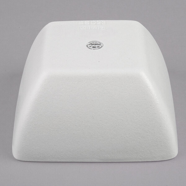 A white square G.E.T. Enterprises Bugambilia bowl with a textured finish.