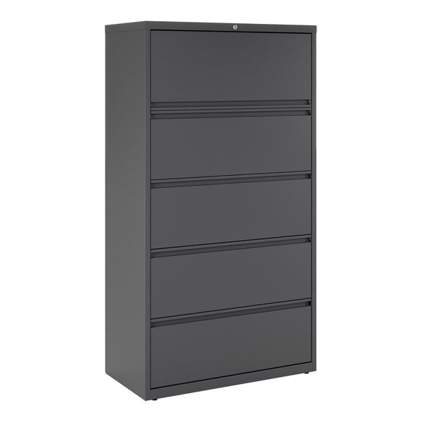 A charcoal five-drawer lateral file cabinet with roll out binder storage.