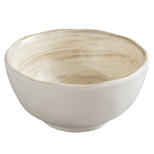 A white melamine bowl with brown speckled edges.