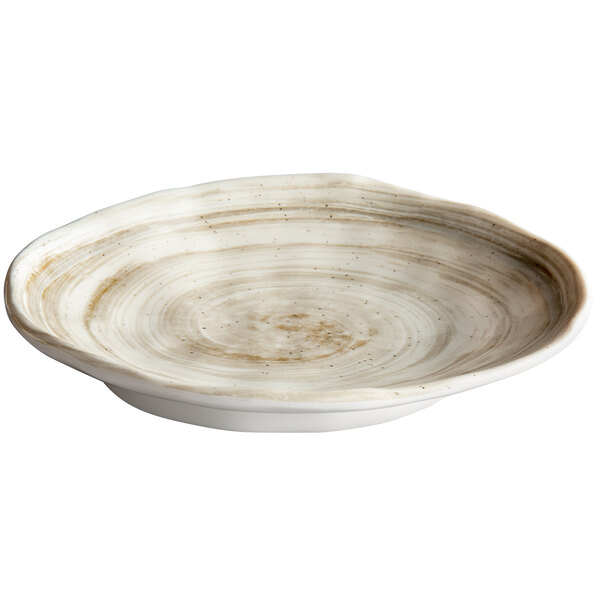 An oval white melamine plate with a brown rim.