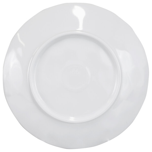 A white plate with a round rim.