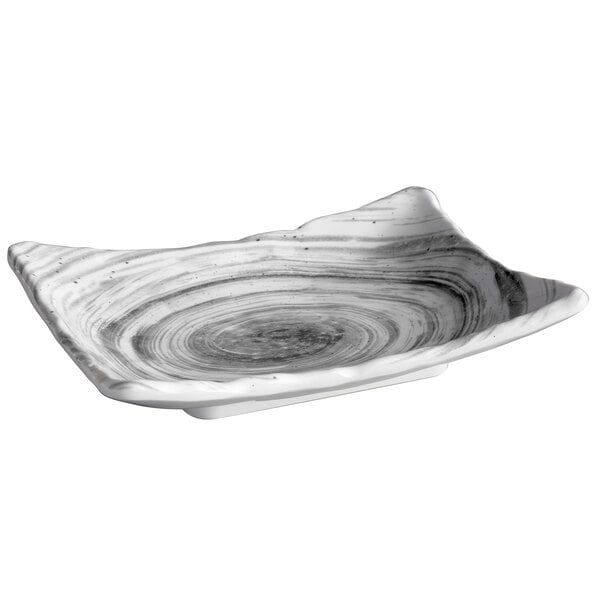 A white rectangular melamine plate with a black swirl design.