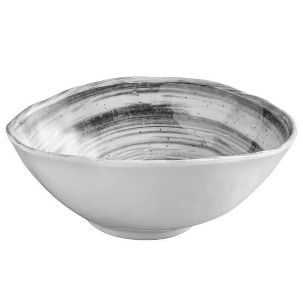 a white bowl with black specks