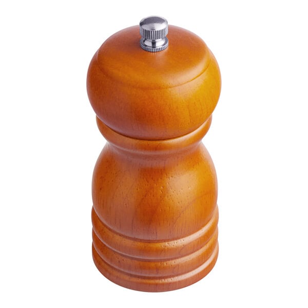 A close-up of a wooden Acopa salt and pepper mill with a metal knob.