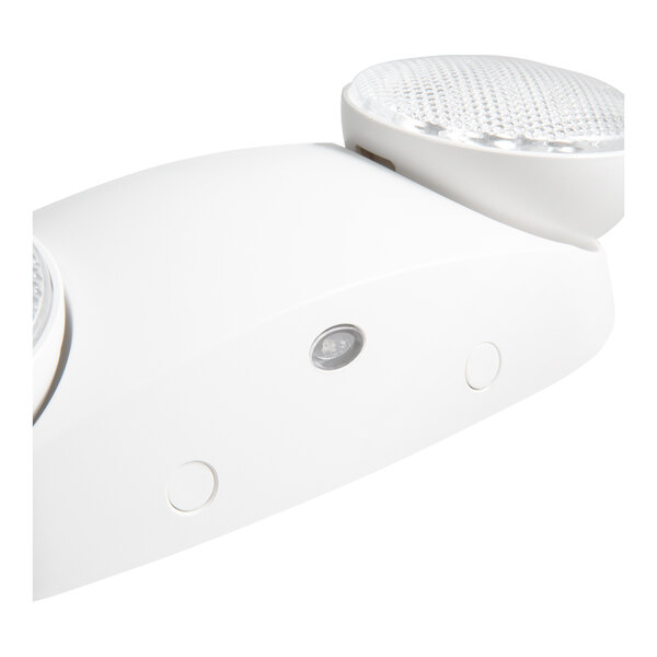 A white Lavex round emergency light with two heads.
