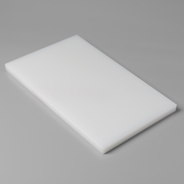 A white rectangular VacPak-It filler plate on a gray surface.