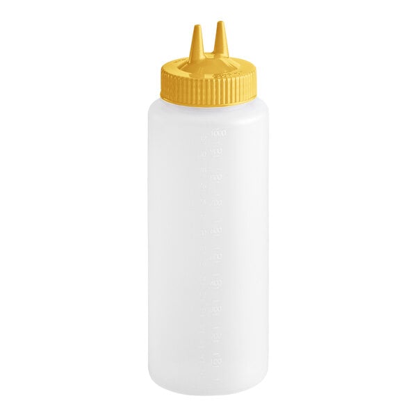 A clear plastic squeeze bottle with a yellow cap featuring two pointed dispensing tips.