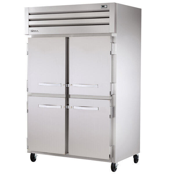 A True Spec Series heated holding cabinet with two solid half doors.