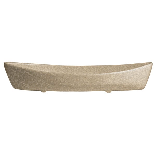 A sand granite rectangular boat with curved edges.