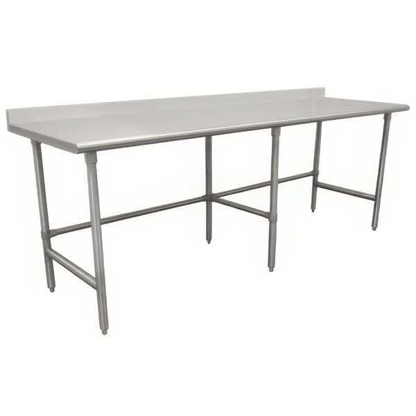 A stainless steel Advance Tabco work table with an open base and a metal bar.