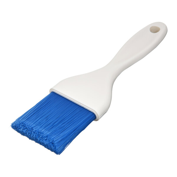 A white-handled brush with blue nylon bristles, featuring a hole at the end of the handle.