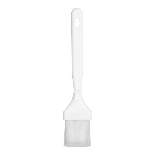 A white brush with a flat, wide head and a long handle featuring a hanging hole.
