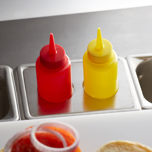 a red and yellow plastic bottles