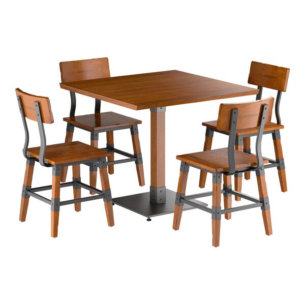 A square wooden table with a central pedestal base, surrounded by four matching wooden chairs with metal accents and backrests.