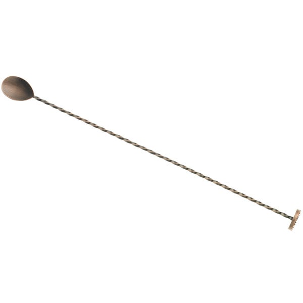 An antique copper-plated stainless steel Barfly bar spoon with a long handle.