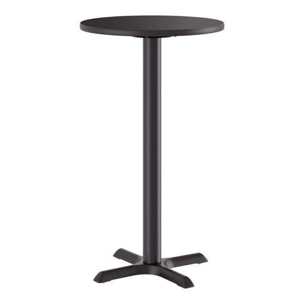 A round, black bar-height table with a single central pedestal and a four-pronged cast iron base.