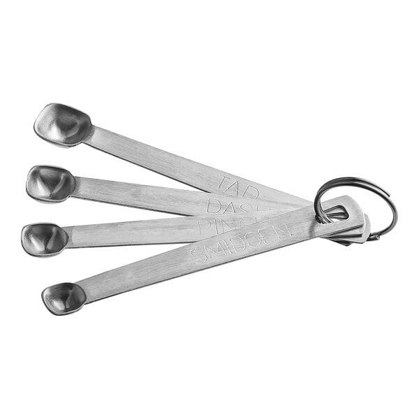 A Tablecraft stainless steel spice measuring spoon set on a counter with a key ring.